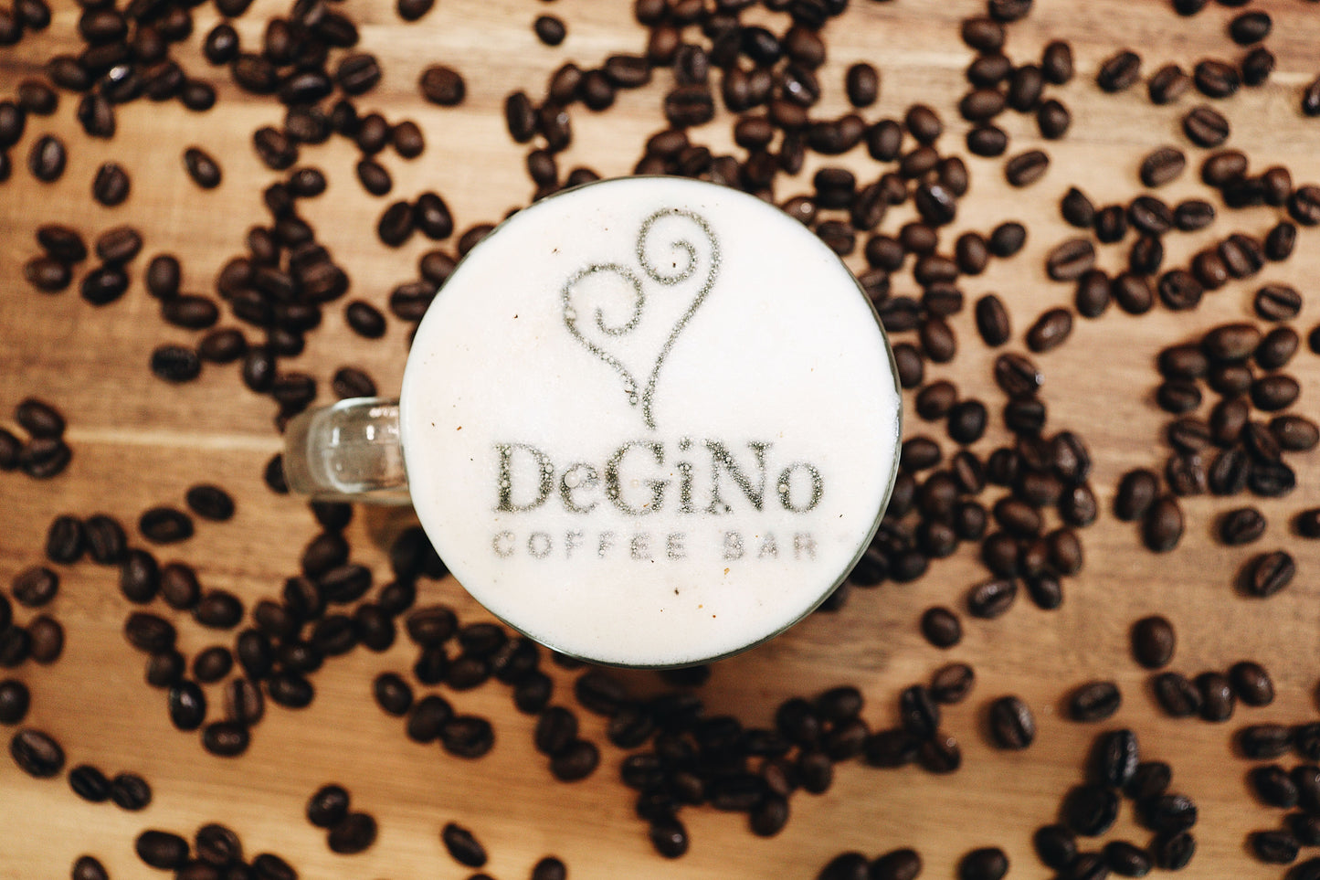 DeGiNo Coffee Beans with brewed coffee image